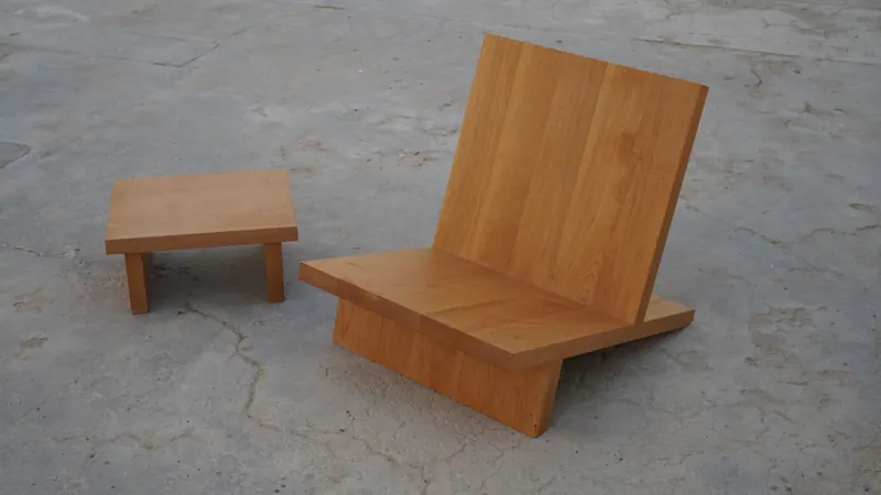 Low lounge chair with matching footstool