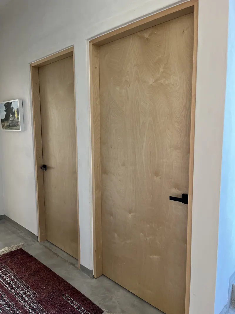 Birch ply interior doors with black handles