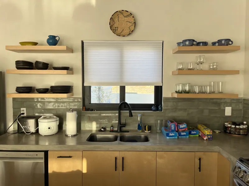 Kitchen with floating shelves and birch ply cabinet fronts